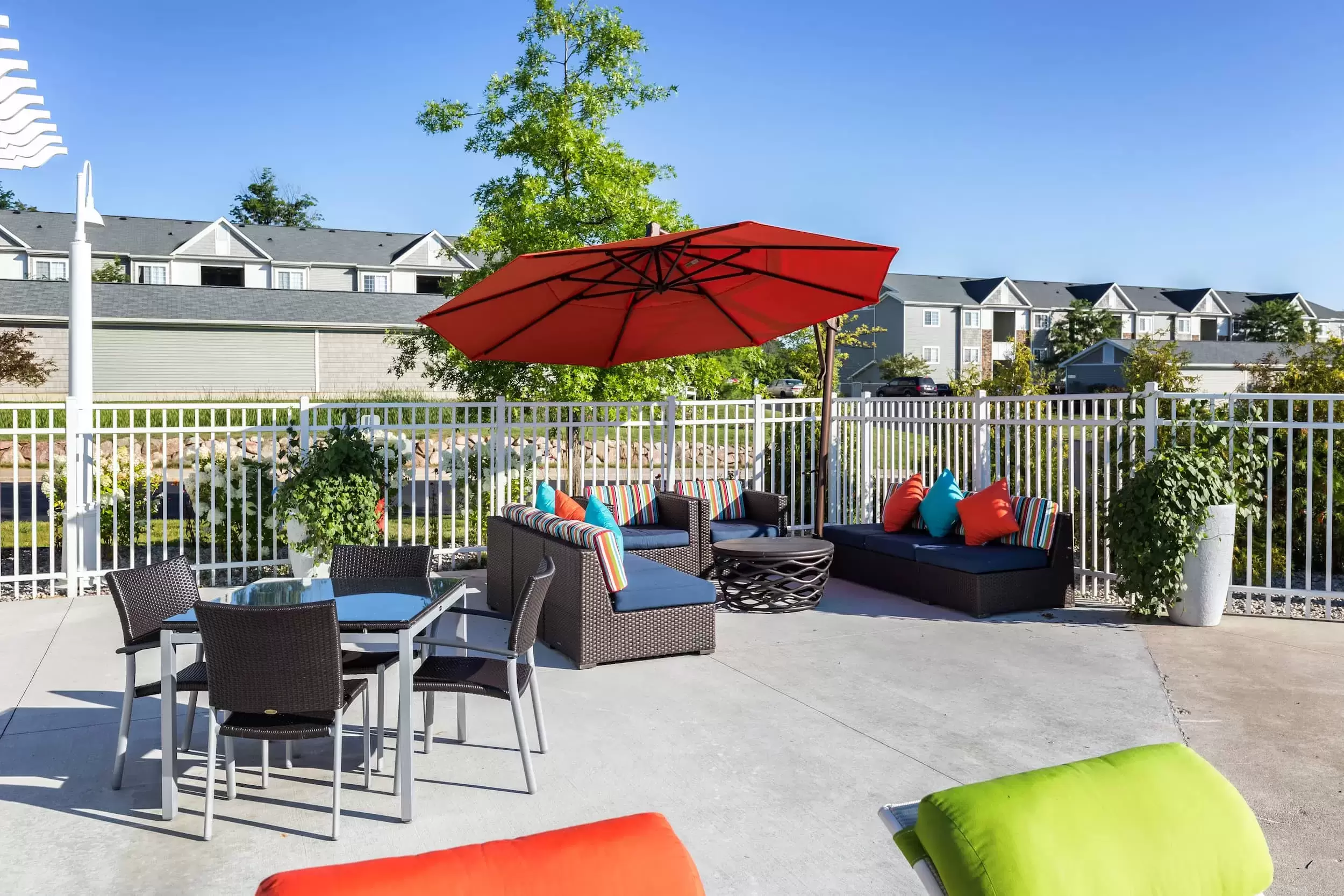 Patio furniture near the pool arranged to make the perfect place to socialize or relax.